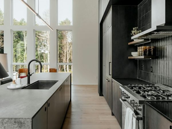 Modern kitchen with stone countertops and natural light
